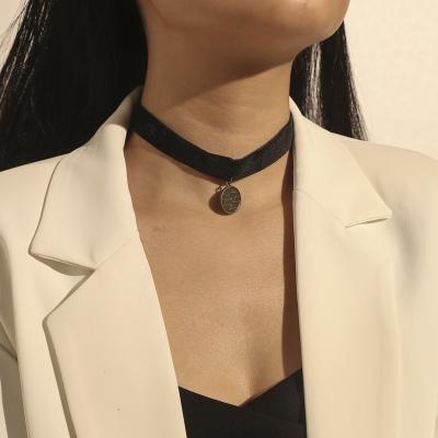 China FASHIONABLE Gold Velvet Short Choker Black Necklace Geometric Round Pendant Scales Carving Necklace for sale