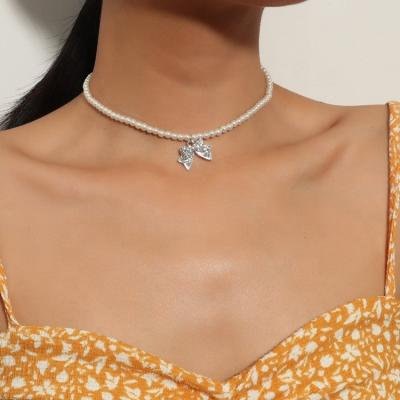 China High Quality/Source Freshwater Pearl Tools New Jewelry Crystal Diamond Bow Drop Choker Necklace Beaded Necklace for sale