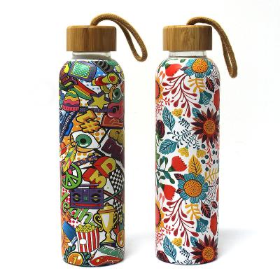 China Disposable Glass Tumbler 650ml Glass Bottle With Bamboo Lid With Carry Loop for sale