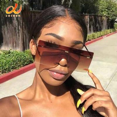 China Fashion Sunglasses Oversized Brown Sunglasses 2022 Women Retro Vintage Sunglasses Luxury Brand Rimless Eyewear for sale