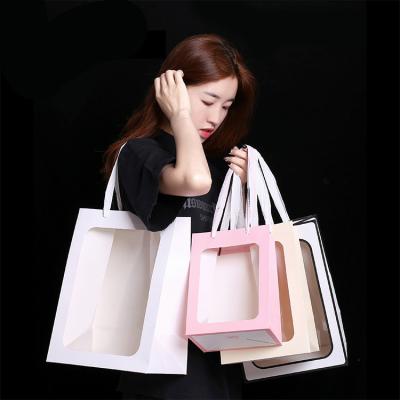 China Recyclable Luxury Cardboard Window PVC Kraft Paper Bag Custom Gift Bag for sale