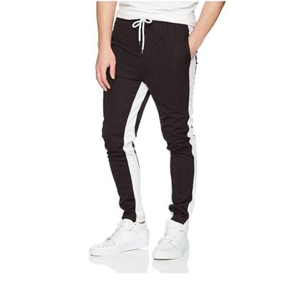 China Street style logo street style polyester custom track pants elastic waistband side band wind men joggers pants elastic for sale