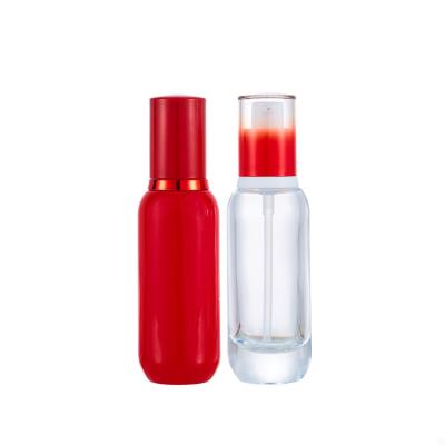 China New Design New Design Luxury Glass Pump Bottle 30ml 1oz Red Clear Cosmetic Packaging for sale