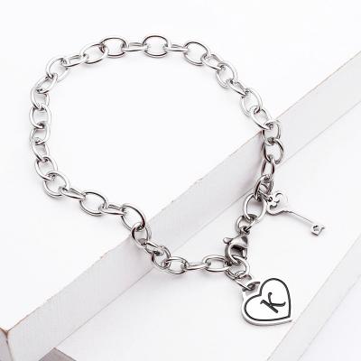 China Eco-friendly Hx Share Initial Bracelet Silver Plated Tasty Personalized Stainless Steel Letter Bracelets for sale