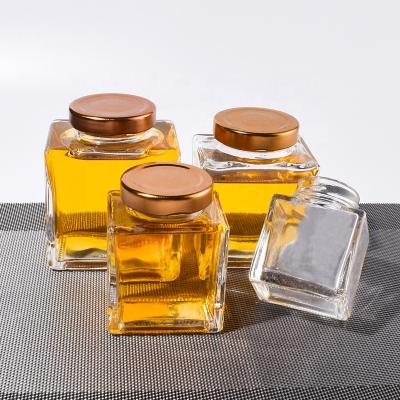 China Food Ru Star Square Thickened Transparent Food Storage Jars Of Different Sizes Glass Honey Jars With Sealed Metal Lids for sale