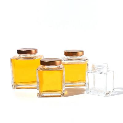 China Food Ru Star High Quality Flat Shoulder Square 180ml Oil Seasoning Storage Food Glass Honey Jar With Metal Lid for sale