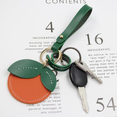 China Cute Orange Leather Key Chain Holder Key Chains Personalized Cartoon Key Chain Gift for sale