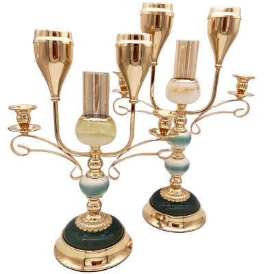 China Romantic Rotary Candlelight Metal Gold Candle Holder with Three Five Ceramic Arms Marble Ornaments for Wedding Party Home Decoration for sale