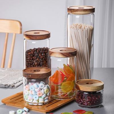 China Wholesale Heatable Transparent Glass Candy Jar Sealed Cans Japanese Style Acacia Wood Tea Cans Snacks Storage Jar for sale