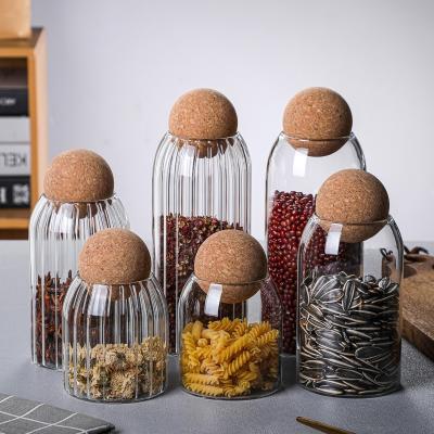 China Heatable Manufacturers Wholesale Round Ball Glass Jar Sets 500ml Borosilicate Glass Bottom Round Spice Storage Jar With Cork Lid for sale