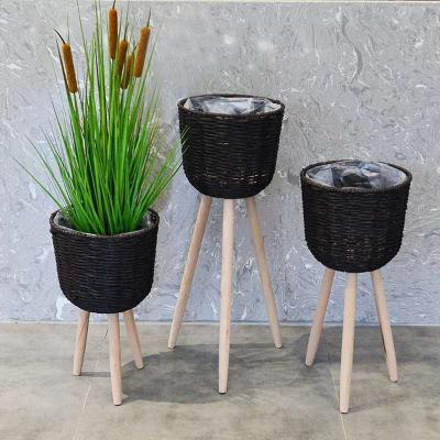 China Modern Handmade Wholesale Cheap Round Shape Artificial Flower Plant Weaving Pot With Wooden Stand for sale