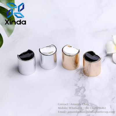 China Aluminum Cosmetic Bottle Caps Disc Top Screw Metal Press Bottle Cap For Shampoo Lotion Cream for sale