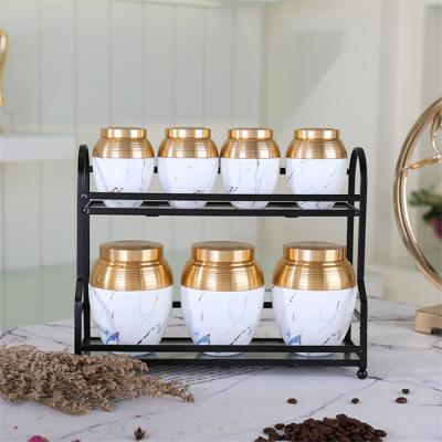 China Amber Modern Eco-Friendly Design Unique Design Kitchen Used 7 Pcs High Quality Porcelain Canister Set With Metal Rack for sale