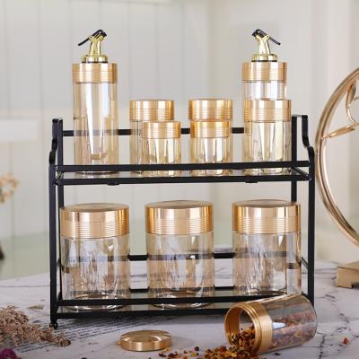 China Viable Custom Unique Golden Vinegar Bottles Tea Coffee Tea Candy Transparent Canister Sets Storage Glass Jar For Sale for sale