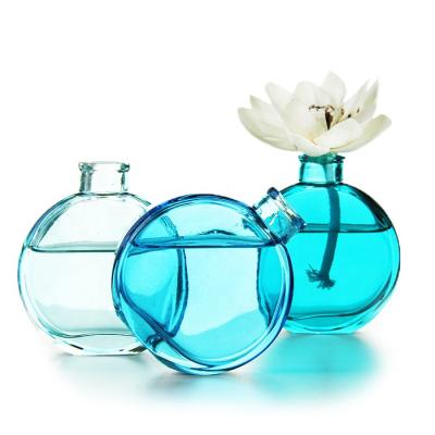 China Perfume 2021 new fashion 150ml flat round aromatherapy bottle glass with cork for sale