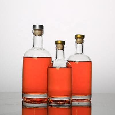 China Vodka 200ml/375ml/500ml/750ml /1000ml round shape vodka glass bottle with cork for sale