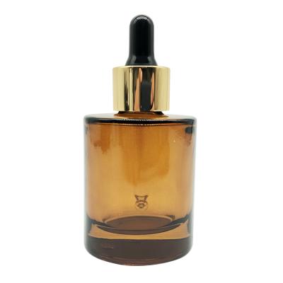 China Luxury Unique Oval Shape 35ml Amber Color Essential Oil Cosmetic Dropper Glass Bottle for sale