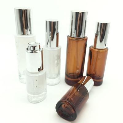 China 2021 New 15ml 30ml 50ml Cosmetics Skin Care Set Glass Cosmetic Bottle With White Pump Glass Bottles for sale