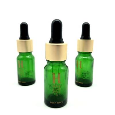 China Cosmetic Packaging 10ml Round Gold Cap Essential Oil Perfume Oil Green Dropper Bottle for sale