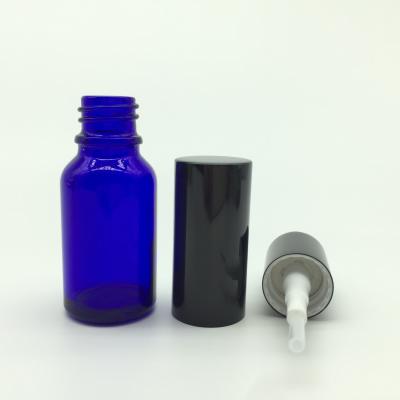 China New Design Cosmetic Round Shape Logo Noble Blue Customized Essential Oil Glass Pump Bottle for sale