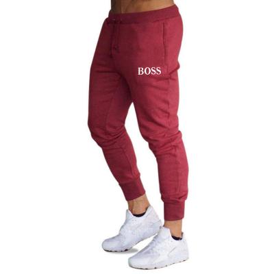 China Anti-Wrinkle Pants High Quality Men's Casual Loose Pants New Custom Logo Men's Stretch Drawstring Plus Size Sweatpants for sale