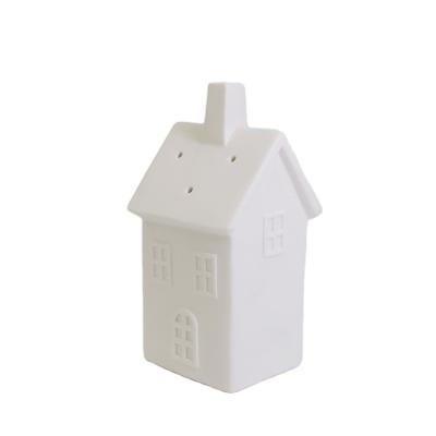 China New Modern Design Of Ceramic Christmas Porcelain Candle Burner Lit House for sale