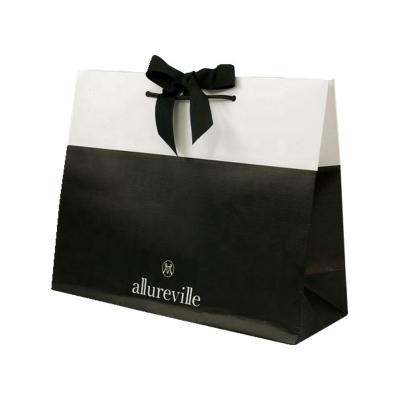 China Recyclable Wholesale Custom Printed Ribbon Bow Tie Paper Shopping Bags for sale