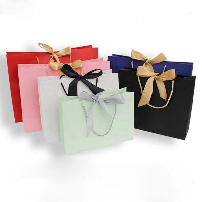 China Recyclable Luxury Custom Logo Printed Paper Shopping Gift Bag With Ribbon Bow for sale