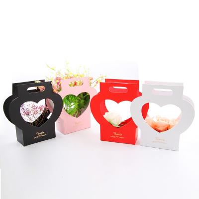 China Recyclable Custom Romantic Wedding Florist Flower Basket Hand Bag Paper Flowers Carrier Bags With Love Handle for sale