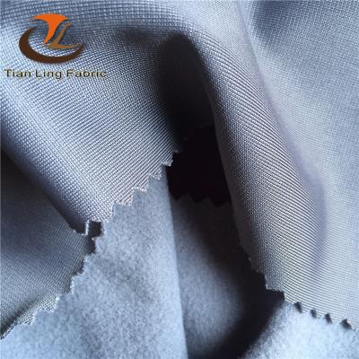 China Super brushed ropa de Para waterproof polyester fleece lycra fabricas de tela for sale