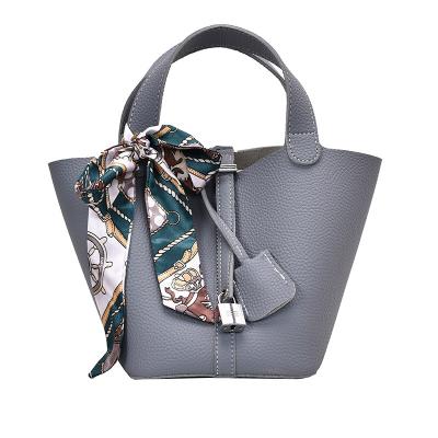 China Waterproof New fashion women's handbag bucket bag multi-functional waterproof decorative silk scarf large capacity leather women's handbag for sale