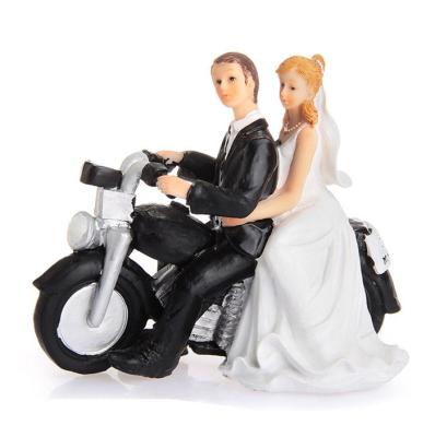 China Europe resin wedding decoration motorcycle cake toppers trailing wedding couple figurine for sale