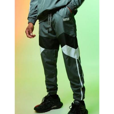 China Custom Anti-Wrinkle Logo Men Color Block Slim Fitted Bottom Narrow Nylon Jogging Pants Refine Anorak Track Pants for sale