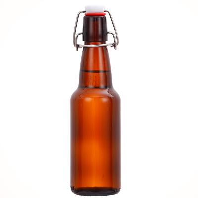 China Liquid Wrapping Bottle Round Flash Amber Glass Bottle With Swing Top For Beer for sale