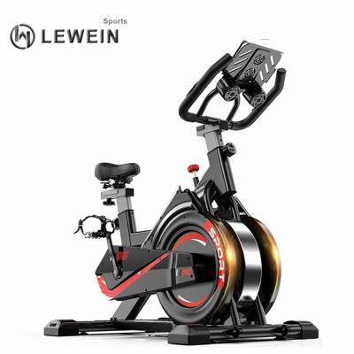 China 2021home gym new factory sale adjustment speed spinning bike LCD display spiral Chinese hot bar magnetic handle for sale