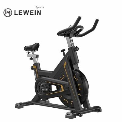 China Universal Custom Logos Fully Wrapped Gym Machine Quieter Home Use Magnetic Spin Bike With Seat for sale