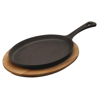 China Sustainable Oval Cast Iron Sizzling Dish Fajita Pan Roasting Pan With Wooden Base for sale