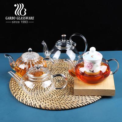 China Viable Wholesale Mouth Blowing Glass Tea Flower Pot With Glass Handle High Borosilicate Glass Teapot With Ceramic Strainer for sale