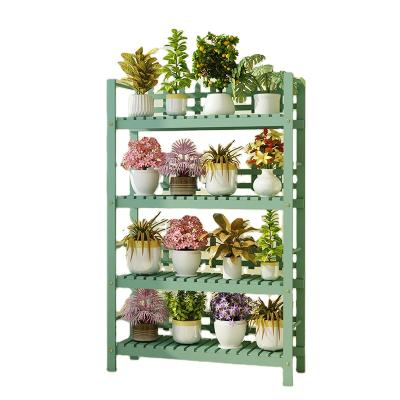 China Modern Wooden Plant Rack 4 Tiers Pine Indoor Garden Flower Plant Stand Stand With Wheels for sale