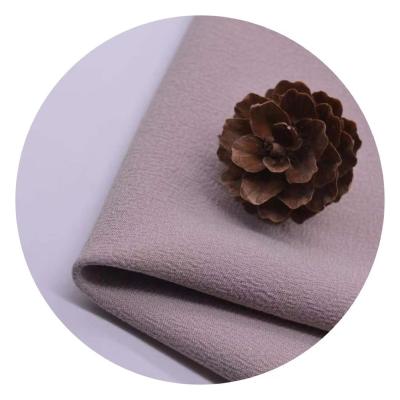 China Anti-Static Plain Dyed Moss Crepe Fabric Woven 100% Polyester High Twist 4 Way Stretch Fabric For Women Dress for sale