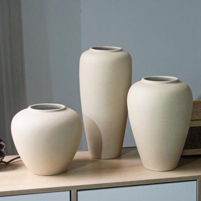 China Nordic Design Clay Tabletop Pot Unique Luxury White Ceramic Vase in Post-modern Style for sale