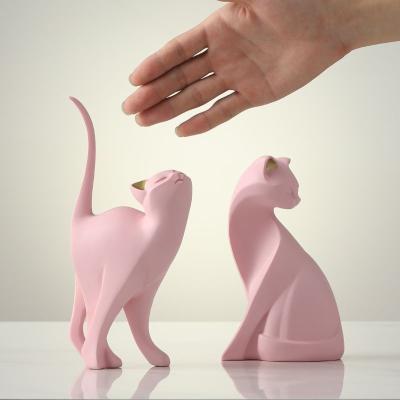 China Home Decor Modern Style Resin Miniature Cat Sculpture with Bamboo and Rattan Rope Accent for sale