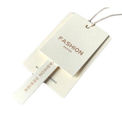 China Sustainable hangtags for clean clothing logo design black gold foil color paper luxury hot stamping gold hangtag for sale