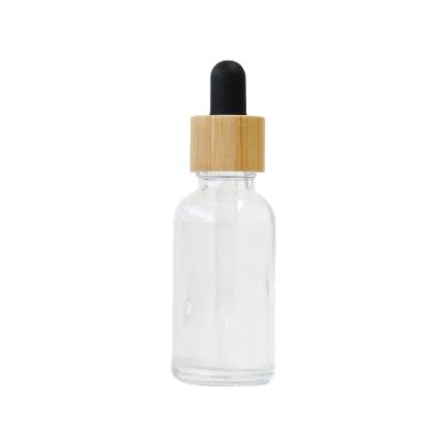 China Pharmaceutical Wholesale Amber Clear Essential Oil CBD 30ml Dropper Glass Bottles With Lid Bamboo Tincture for sale