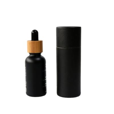 China Pharmaceutical Hot Sale Bamboo Cap 30ml Black Essential Oil Glass Bottle With Tincture Dropper for sale