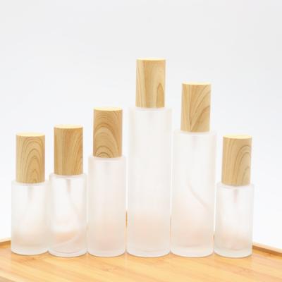 China Hot Sale Cosmetic Glass Pump Bottle Cosmetic Set Bottle 50ml 100ml Frosted Glass Lotion Serum Pump Bottle for sale