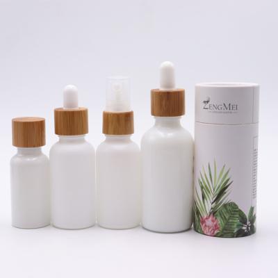 China Personal Care 30ml 10ml 50ml Hemp CBD Oil Dropper Bottle White Ceramic Vape Oil Bottle e Glass Bottle With Bamboo Cap for sale