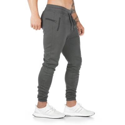 China Wholesale Breathable Sports Tracksuit And Private Label Gym Wear Athleisure Pants With Pockets Custom Logo Mens Skinny Sports Joggers Trousers for sale