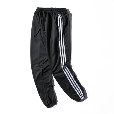 China Men's Oversized Three-Stripe Pants Anti-Wrinkle Track Casual Pants Teens Slim Fit Sports Pants for sale