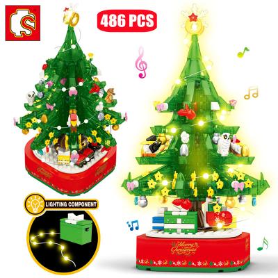 China DIY TOY Christmas Series Rotating LED Shining Music Box Building Block Friends Treehouse Bricks Toys for Kids Gifts for sale